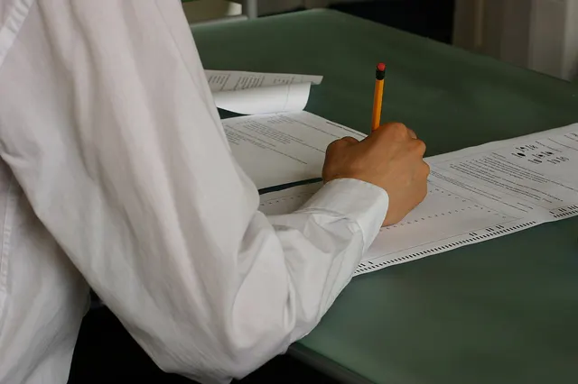 Photograph: Hand writing exam classroom.