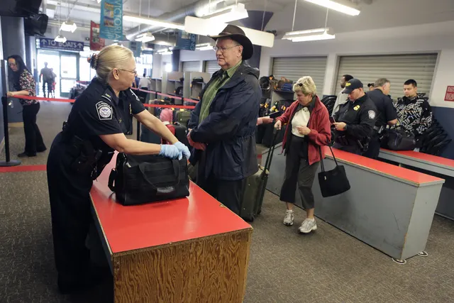 Photograph: CBP officer conducts a bag inspection.