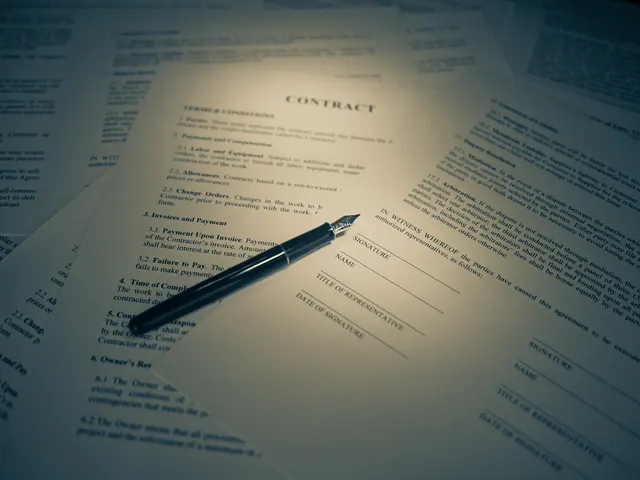 Photograph: A printed contract with signature lines and a fountain pen resting on it.