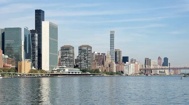 Photograph: Shore of the East River with United Nations Headquarters, New York City.