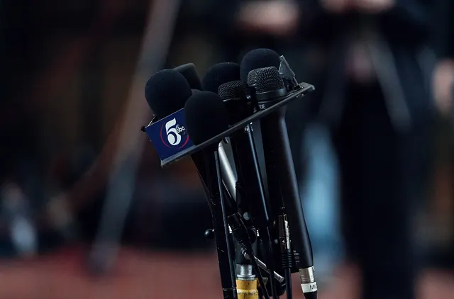 Photograph: News Microphones at Press Conference.