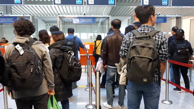 Photograph: Passport control at Warsaw Chopin Airport.