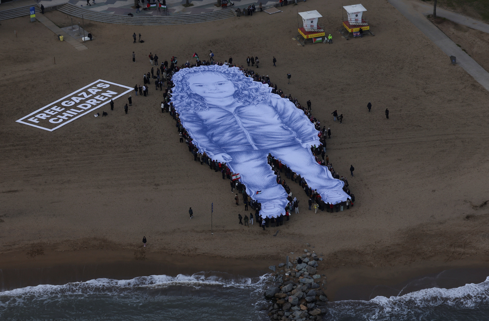 Giant Hind Rajab portrait unveiled in Spain for anniversary of her killing | Humanitarian Crises Giant Hind Rajab portrait unveiled in Spain for anniversary of her killing | Humanitarian Crises